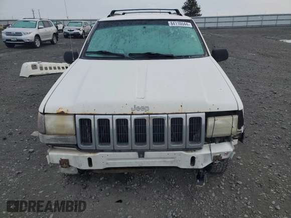 1998 Jeep Grand Cherokee Laredo with VIN 1J4GZ48S1WC165851, listed as a Copart auction lot 84110044 with 306,484 mi miles and Salvage Title. Bid and sale history available at carsss.com. Image 5.