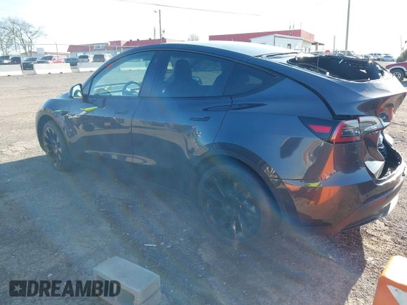 2021 Tesla Model Y Long Range with VIN 5YJYGAEE1MF149887, listed as a IAAI auction lot 42032104 with 54,932 mi miles. Bid and sale history available at carsss.com. Image 3.