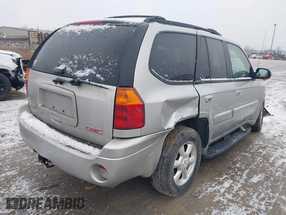 2005 GMC Envoy SLT with VIN 1GKDT13S352258640, listed as a IAAI auction lot 41226997 with 159,665 mi miles. Bid and sale history available at carsss.com. Image 4.