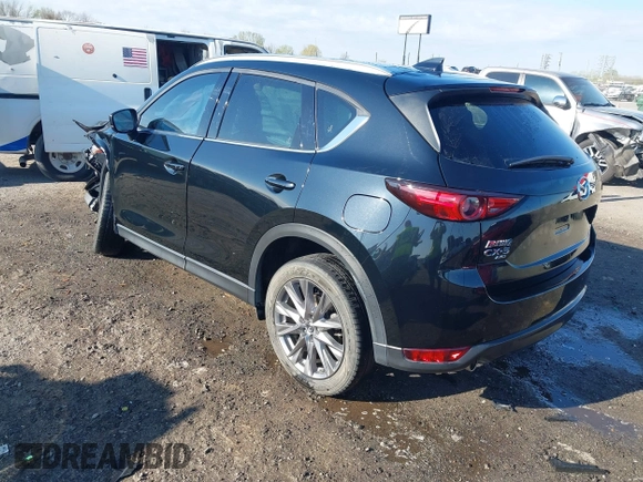 2020 Mazda CX-5 Grand Touring with VIN JM3KFBDM0L0790508, listed as a IAAI auction lot 41883319 with 114,398 mi miles and . Bid and sale history available at carsss.com. Image 3.
