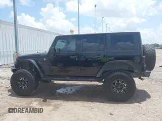 2008 Jeep Wrangler Unlimited X z VIN 1J4GA39148L560004, wystawiony jako IAAI lot #42523657 z przebiegiem 116 619 mil mil oraz . Historia ofert i sprzedaży dostępna na DreamBid. Obrazek 14.