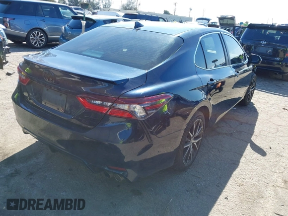 2021 Toyota Camry SE Nightshade with VIN 4T1G11AK6MU526029, listed as a IAAI auction lot 41626272 with 82,987 mi miles and . Bid and sale history available at DreamBid. Image 4.