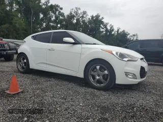 2012 Hyundai Veloster w/Black Int z VIN KMHTC6AD1CU030478, wystawiony jako Copart lot #62715005 z przebiegiem 127 625 mil mil oraz Szkoda całkowita • Salvage title. Historia ofert i sprzedaży dostępna na DreamBid. Obrazek 4.