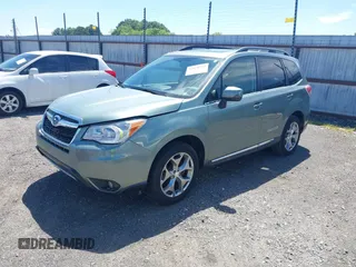 2016 Subaru Forester Touring with VIN JF2SJAVCXGH490507, listed as a IAAI auction lot 42070715 with 98,456 mi miles and . Bid and sale history available at DreamBid. Image 2.