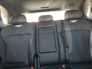 2018 Bentley Bentayga Signature z VIN SJAAC2ZV3JC016779, wystawiony jako Copart lot #54077865 z przebiegiem Nie podano mil oraz Szkoda całkowita • Salvage title. Historia ofert i sprzedaży dostępna na DreamBid. Obrazek 10.