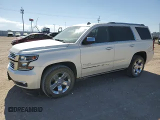 2015 Chevrolet Tahoe LTZ with VIN 1GNSKCKC4FR102974, listed as a Copart auction lot 57102155 with 170,331 mi miles and Salvage title. Bid and sale history available at DreamBid. Image 1.