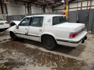 1992 Dodge Dynasty LE z VIN 1B3XC56RXND822802, wystawiony jako Copart lot #82799714 z przebiegiem 137 131 mil mil oraz Szkoda całkowita • Salvage title. Historia ofert i sprzedaży dostępna na DreamBid. Obrazek 2.