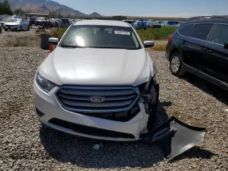 2015 Ford Taurus SEL z VIN 1FAHP2E8XFG181929, wystawiony jako Copart lot #64022325 z przebiegiem 106 272 mil mil oraz Szkoda całkowita • Salvage title. Historia ofert i sprzedaży dostępna na DreamBid. Obrazek 5.