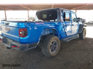 2021 Jeep Gladiator Rubicon with VIN 1C6JJTBGXML516164, listed as a IAAI auction lot 41837544 with 48,197 mi miles. Bid and sale history available at carsss.com. Image 4.