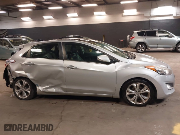 2013 Hyundai Elantra GT with VIN KMHD35LE2DU105677, listed as a IAAI auction lot 42027623 with 137,063 mi miles. Bid and sale history available at carsss.com. Image 13.