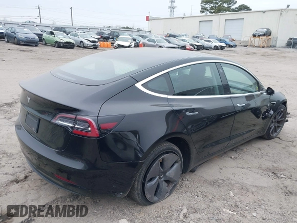2019 Tesla Model 3 Mid Range with VIN 5YJ3E1EA5KF297213, listed as a IAAI auction lot 41361412 with 93,801 mi miles and . Bid and sale history available at carsss.com. Image 4.