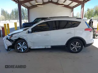 2018 Toyota RAV4 XLE with VIN JTMRFREVXJD240388, listed as a IAAI auction lot 42052065 with 117,114 mi miles. Bid and sale history available at carsss.com. Image 15.
