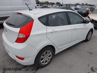 2012 Hyundai Accent GS with VIN KMHCT5AE4CU051716, listed as a IAAI auction lot 41692287 with 173,861 mi miles. Bid and sale history available at carsss.com. Image 4.