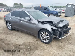 2015 Infiniti Q50 Premium z VIN JN1BV7AP7FM338434, wystawiony jako IAAI lot #42158445 z przebiegiem 115 685 mil mil oraz . Historia ofert i sprzedaży dostępna na DreamBid. Obrazek 1.