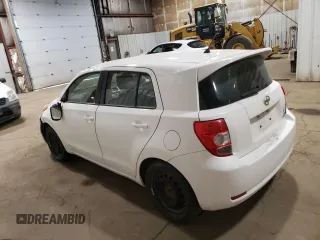2014 Scion xD with VIN JTKKUPB48E1046627, listed as a Copart auction lot 61498995 with 63,452 mi miles and Salvage title. Bid and sale history available at DreamBid. Image 2.