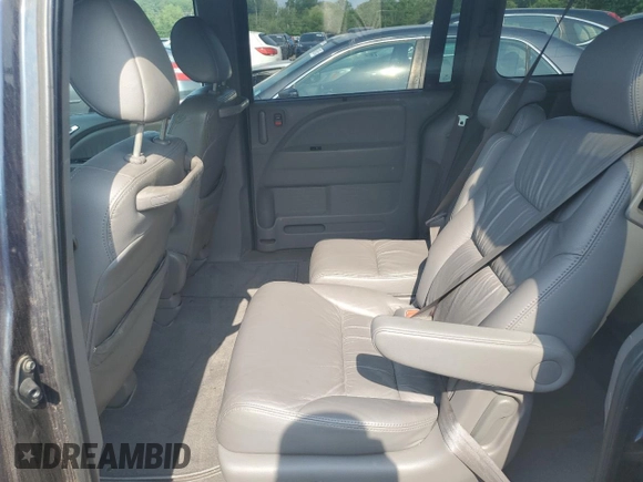 2010 Honda Odyssey EX-L z VIN 5FNRL3H73AB089714, wystawiony jako Copart lot #60276305 z przebiegiem 125 025 mil mil oraz Szkoda całkowita • Salvage title. Historia ofert i sprzedaży dostępna na DreamBid. Obrazek 11.