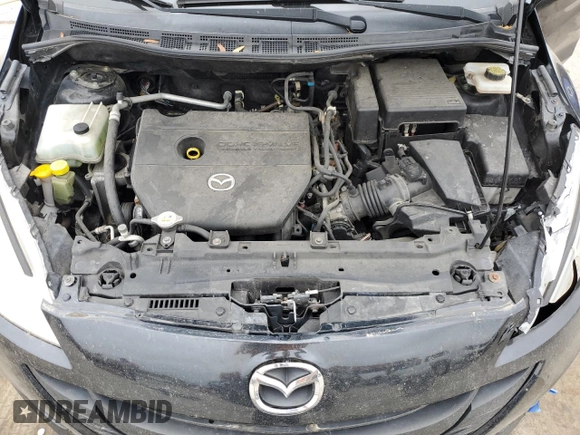 2015 Mazda 5 Sport with VIN JM1CW2BLXF0184094, listed as a Copart auction lot 56618405 with 98,757 mi miles and Salvage title. Bid and sale history available at DreamBid. Image 11.