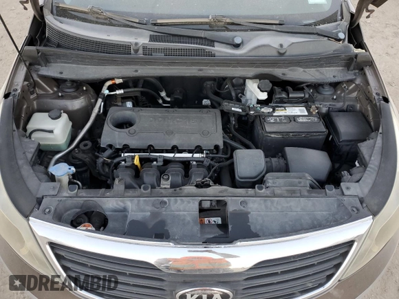 2013 Kia Sportage LX z VIN KNDPB3A23D7465413, wystawiony jako Copart lot #83694894 z przebiegiem 122 467 mil mil oraz Szkoda całkowita • Salvage title. Historia ofert i sprzedaży dostępna na DreamBid. Obrazek 11.