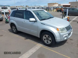 2011 Suzuki Grand Vitara Premium with VIN JS3TE0D22B4100818, listed as a IAAI auction lot 42268458 with 101,376 mi miles and . Bid and sale history available at DreamBid. Image 1.