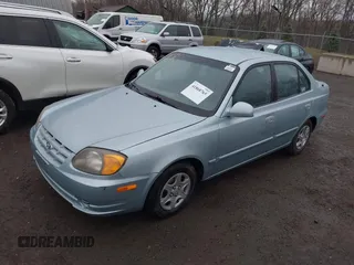 2003 Hyundai Accent GL with VIN KMHCG45C33U473080, listed as a IAAI auction lot 41868765 with 57,478 mi miles. Bid and sale history available at carsss.com. Image 2.
