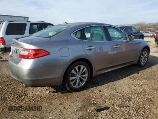 2014 Infiniti M37 with VIN JN1BY1AP2EM260051, listed as a Copart auction lot 87276884 with 101,899 mi miles and Salvage Title. Bid and sale history available at carsss.com. Image 3.