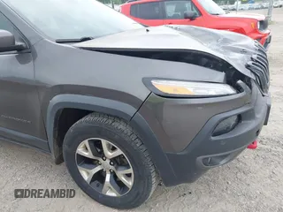 2015 Jeep Cherokee Trailhawk with VIN 1C4PJMBSXFW654754, listed as a IAAI auction lot 39935278 with 128,076 mi miles and . Bid and sale history available at DreamBid. Image 12.