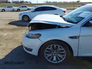 2014 Ford Taurus Limited with VIN 1FAHP2F89EG155934, listed as a IAAI auction lot 41760703 with 130,280 mi miles. Bid and sale history available at carsss.com. Image 6.