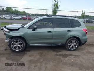 2015 Subaru Forester Touring with VIN JF2SJAWC9FH561581, listed as a IAAI auction lot 42237512 with 109,210 mi miles and . Bid and sale history available at DreamBid. Image 14.