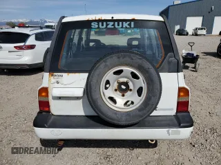 1995 Suzuki Sidekick z VIN JS3TD03V4S4113472, wystawiony jako Copart lot #51279074 z przebiegiem 199 736 mil mil oraz Tytuł czysty. Historia ofert i sprzedaży dostępna na DreamBid. Obrazek 6.