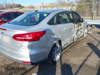 2018 Ford Focus SE with VIN 1FADP3F28JL239860, listed as a IAAI auction lot 41497350 with 84,666 mi miles. Bid and sale history available at carsss.com. Image 4.