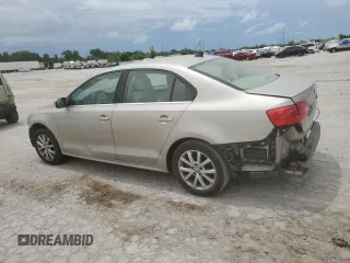 2014 Volkswagen Jetta SE with VIN 3VWD07AJ6EM209228, listed as a Copart auction lot 60500525 with 118,261 mi miles and Salvage title. Bid and sale history available at DreamBid. Image 2.