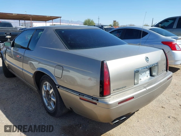 2001 Cadillac Eldorado Touring ETC z VIN 1G6ET12971B109319, wystawiony jako IAAI lot #41682779 z przebiegiem 147 515 mil mil oraz . Historia ofert i sprzedaży dostępna na DreamBid. Obrazek 11.