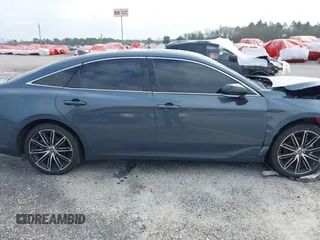 2022 Toyota Avalon Touring z VIN 4T1HZ1FB3NU088304, wystawiony jako IAAI lot #36419998 z przebiegiem 14 956 mil mil oraz . Historia ofert i sprzedaży dostępna na DreamBid. Obrazek 12.