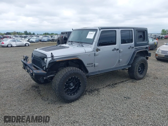 2018 Jeep Wrangler Unlimited Sport S with VIN 1C4BJWDG4JL861052, listed as a IAAI auction lot 42100517 with 43,907 mi miles and . Bid and sale history available at DreamBid. Image 2.