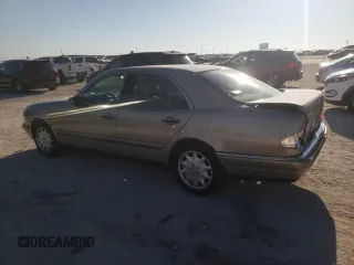 1996 Mercedes-Benz E-Class with VIN WDBJF55F7TJ022765, listed as a Copart auction lot 70577504 with 186,340 mi miles and Salvage Title. Bid and sale history available at carsss.com. Image 2.