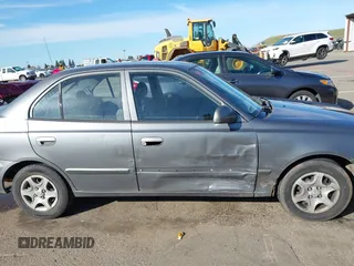 2004 Hyundai Accent GL with VIN KMHCG45C04U531177, listed as a IAAI auction lot 41526033 with 126,102 mi miles. Bid and sale history available at carsss.com. Image 13.