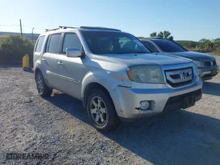 2009 Honda Pilot Touring with VIN 5FNYF38839B027608, listed as a IAAI auction lot 42035708 with 264,332 mi miles. Bid and sale history available at carsss.com. Image 1.