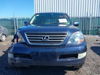 2005 Lexus GX with VIN JTJBT20XX50081621, listed as a IAAI auction lot 41661384 with 208,071 mi miles. Bid and sale history available at carsss.com. Image 12.