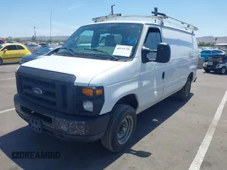 2014 Ford Econoline Cargo Commercial with VIN 1FTNE1EW9EDA17227, listed as a IAAI auction lot 40119708 with 231,292 mi miles and . Bid and sale history available at DreamBid. Image 2.