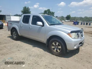 2010 Nissan Frontier SE with VIN 1N6AD0EV0AC447258, listed as a Copart auction lot 64122925 with 112,397 mi miles and Clean title. Bid and sale history available at DreamBid. Image 4.