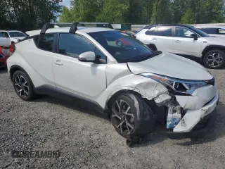 2018 Toyota C-HR XLE with VIN NMTKHMBX9JR060424, listed as a Copart auction lot 57913775 with 104,847 mi miles and Salvage title. Bid and sale history available at DreamBid. Image 4.