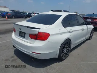 2014 BMW 3 Series 328i with VIN WBA3C1C52EK110753, listed as a IAAI auction lot 42444129 with 169,035 mi miles and . Bid and sale history available at DreamBid. Image 4.