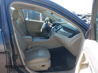 2015 Ford Taurus SEL z VIN 1FAHP2E80FG143819, wystawiony jako IAAI lot #42316114 z przebiegiem 103 959 mil mil oraz . Historia ofert i sprzedaży dostępna na DreamBid. Obrazek 5.