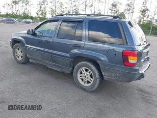 2004 Jeep Grand Cherokee Laredo with VIN 1J4GW48S24C101792, listed as a IAAI auction lot 41995351 with 138,317 mi miles. Bid and sale history available at carsss.com. Image 3.