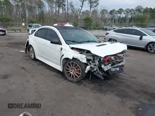 2011 Mitsubishi Lancer Evolution GSR with VIN JA32W8FV9BU045781, listed as a IAAI auction lot 41308314 with 102,840 mi miles. Bid and sale history available at carsss.com. Image 1.