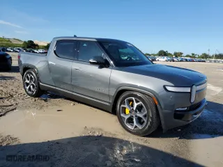 2022 Rivian R1T Adventure Package with VIN 7FCTGAAA6NN013037, listed as a Copart auction lot 75548964 with 8,877 mi miles and Salvage Title. Bid and sale history available at carsss.com. Image 4.