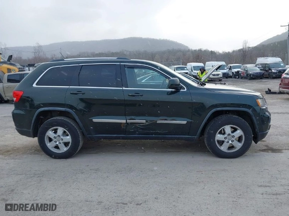 2011 Jeep Grand Cherokee Laredo with VIN 1J4RR4GG9BC546198, listed as a IAAI auction lot 41879387 with 190,973 mi miles. Bid and sale history available at carsss.com. Image 13.