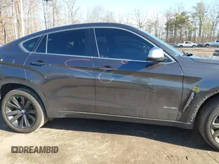 2019 BMW X6 xDrive35i z VIN 5UXKU2C51K0Z64589, wystawiony jako IAAI lot #41537380 z przebiegiem 60 769 mil mil oraz . Historia ofert i sprzedaży dostępna na DreamBid. Obrazek 14.