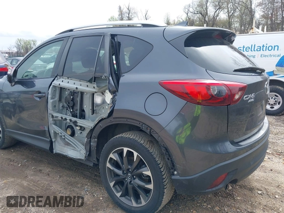 2016 Mazda CX-5 Grand Touring with VIN JM3KE4DYXG0830150, listed as a IAAI auction lot 41961007 with 142,570 mi miles and . Bid and sale history available at DreamBid. Image 6.