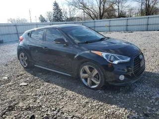2015 Hyundai Veloster Turbo with VIN KMHTC6AE9FU217724, listed as a Copart auction lot 49740814 with 125,625 mi miles and Clean Title. Bid and sale history available at carsss.com. Image 4.